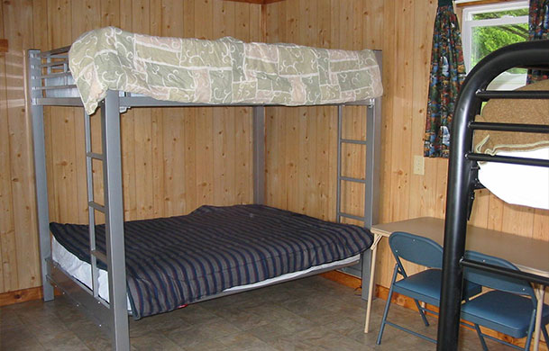 rustic lakefront sleeping cabin rental interior bunk